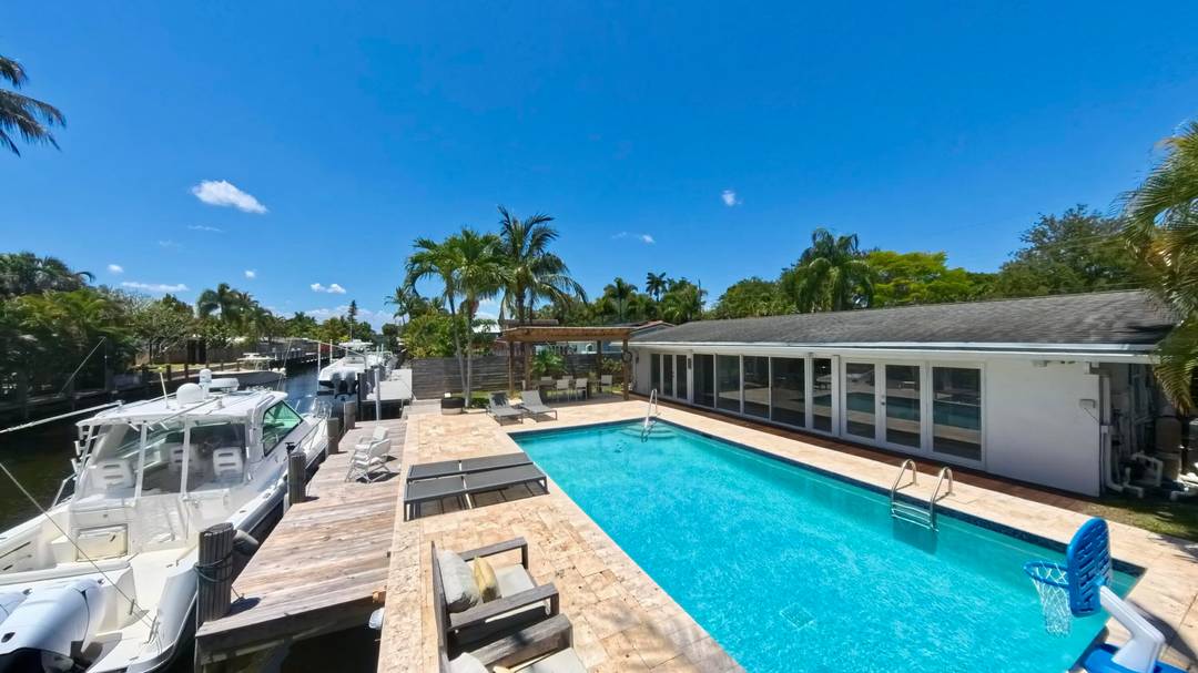 Welcome to Gill Isles ! Updated 3 bed 2 bath home with additional Florida room No Fixed Bridges 65 foot seawall new 40 foot dock, plus, an oversized heated saltwater ...