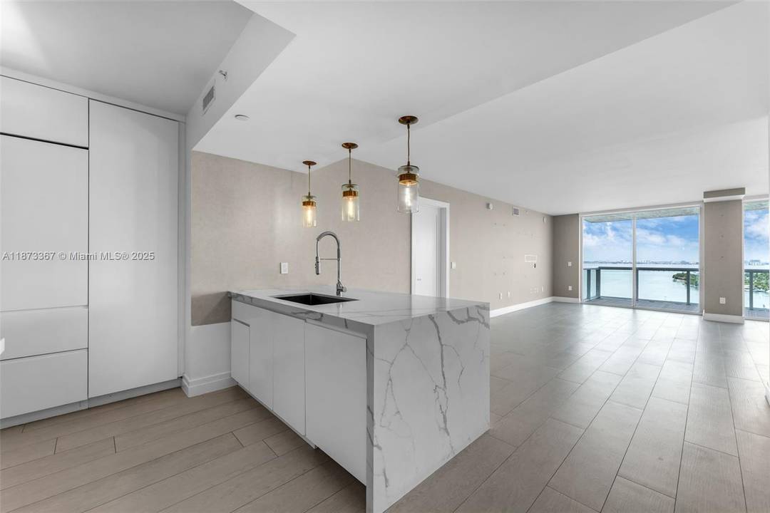 High floor residence in boutique lux building, The Grand Venetian, features 2 spacious balconies w panoramic views that capture Miami Beach living at its finest !