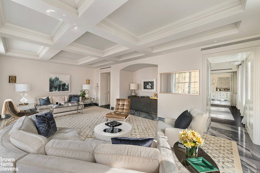 This elegant full floor pre war condominium offers a unique blend of glamour and bespoke design, featuring three bedrooms, four and a half baths, a library, a formal dining room, ...