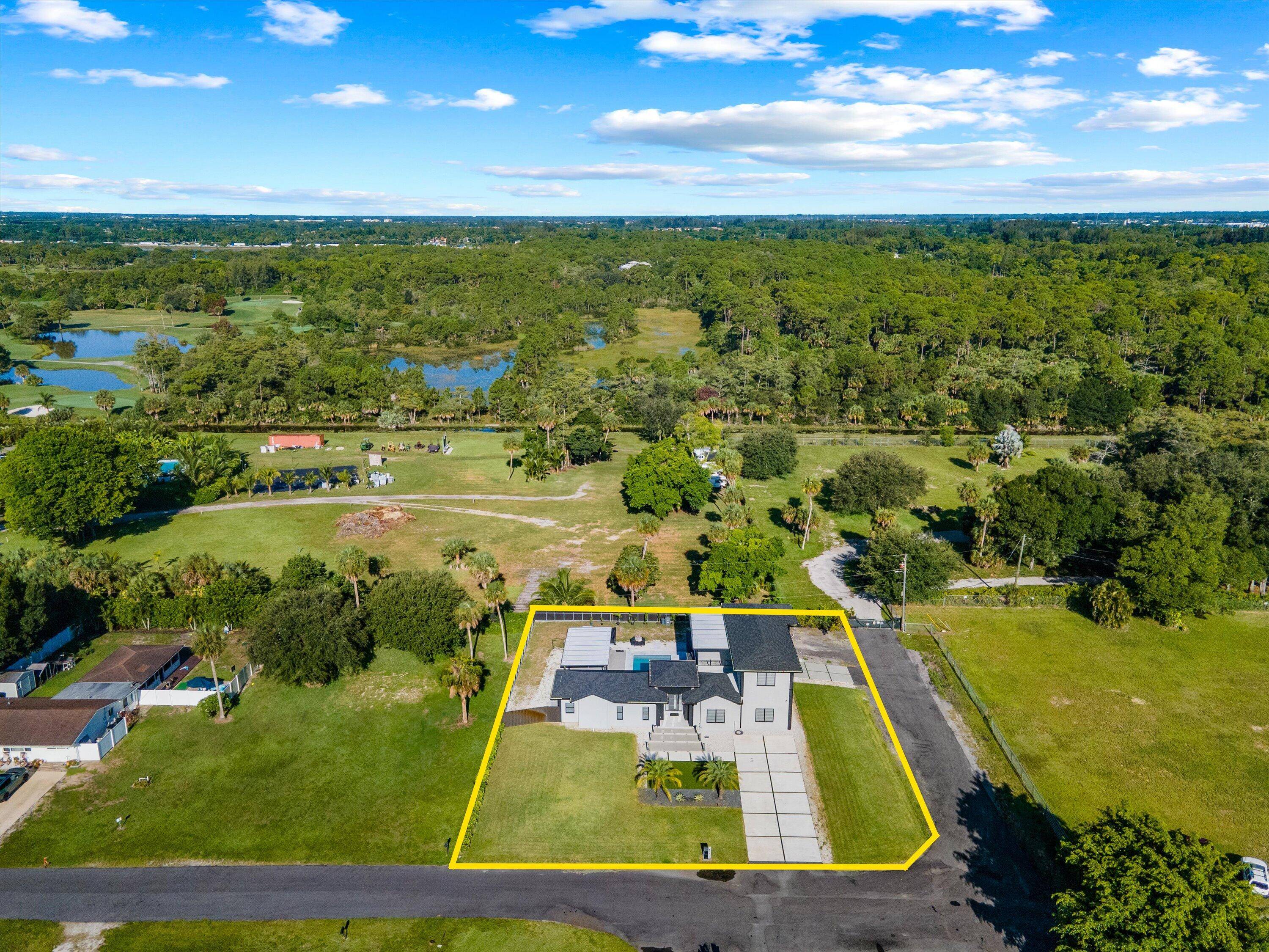 Experience modern living in this newly constructed, stunning 2 story estate in Palm Beach Farms.