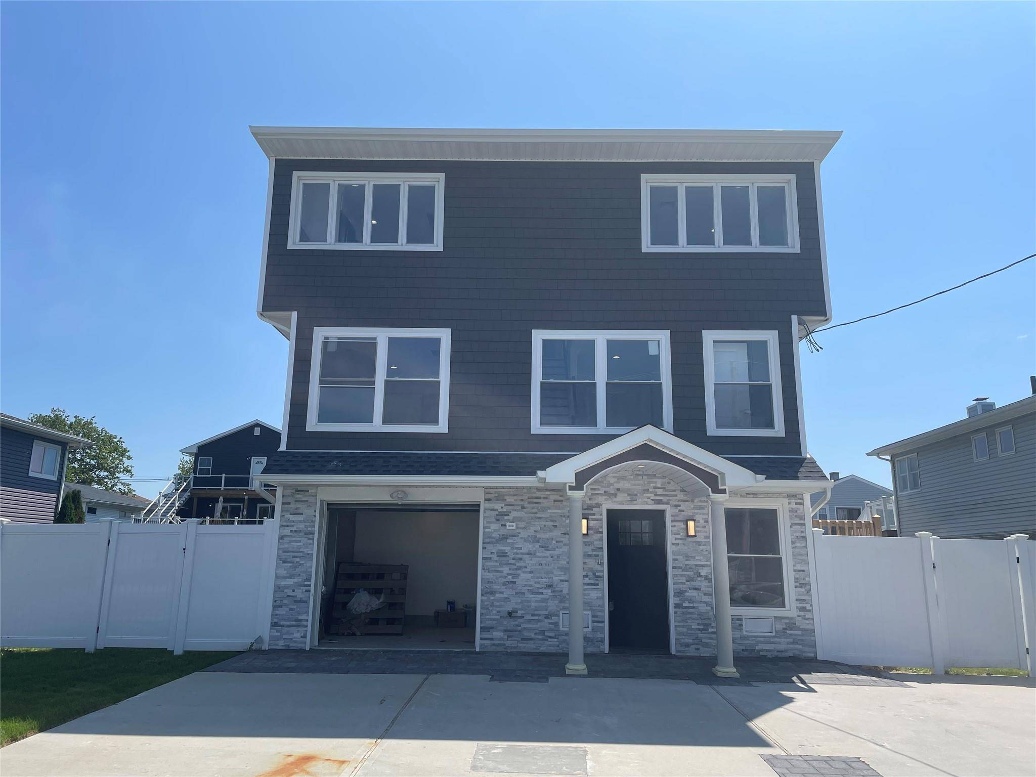 Experience The Epitome Of Coastal Living In This Sun Drenched New Construction FEMA Compliant 5 Bedroom 3 Bath Home On The Water With New Bulkheading To Enjoy Spectacular Views And ...