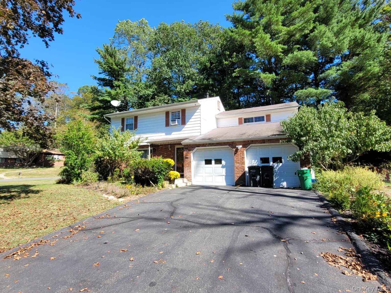 This bright and inviting 4 bedroom colonial features a spacious kitchen with plenty of storage, hardwood floors, and large windows that fill the home with natural light.