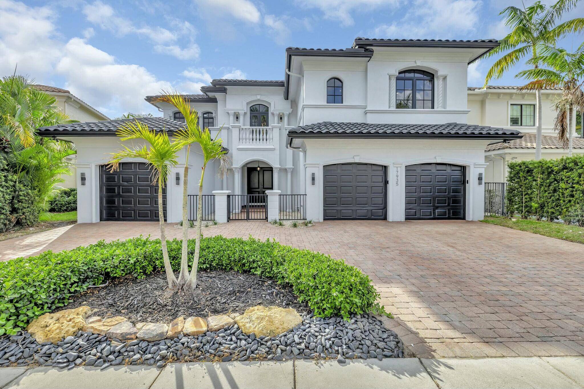 Nestled in the prestigious community of The Oaks at Boca Raton, this fully renovated Mediterranean style estate seamlessly blends contemporary elegance with resort style living.
