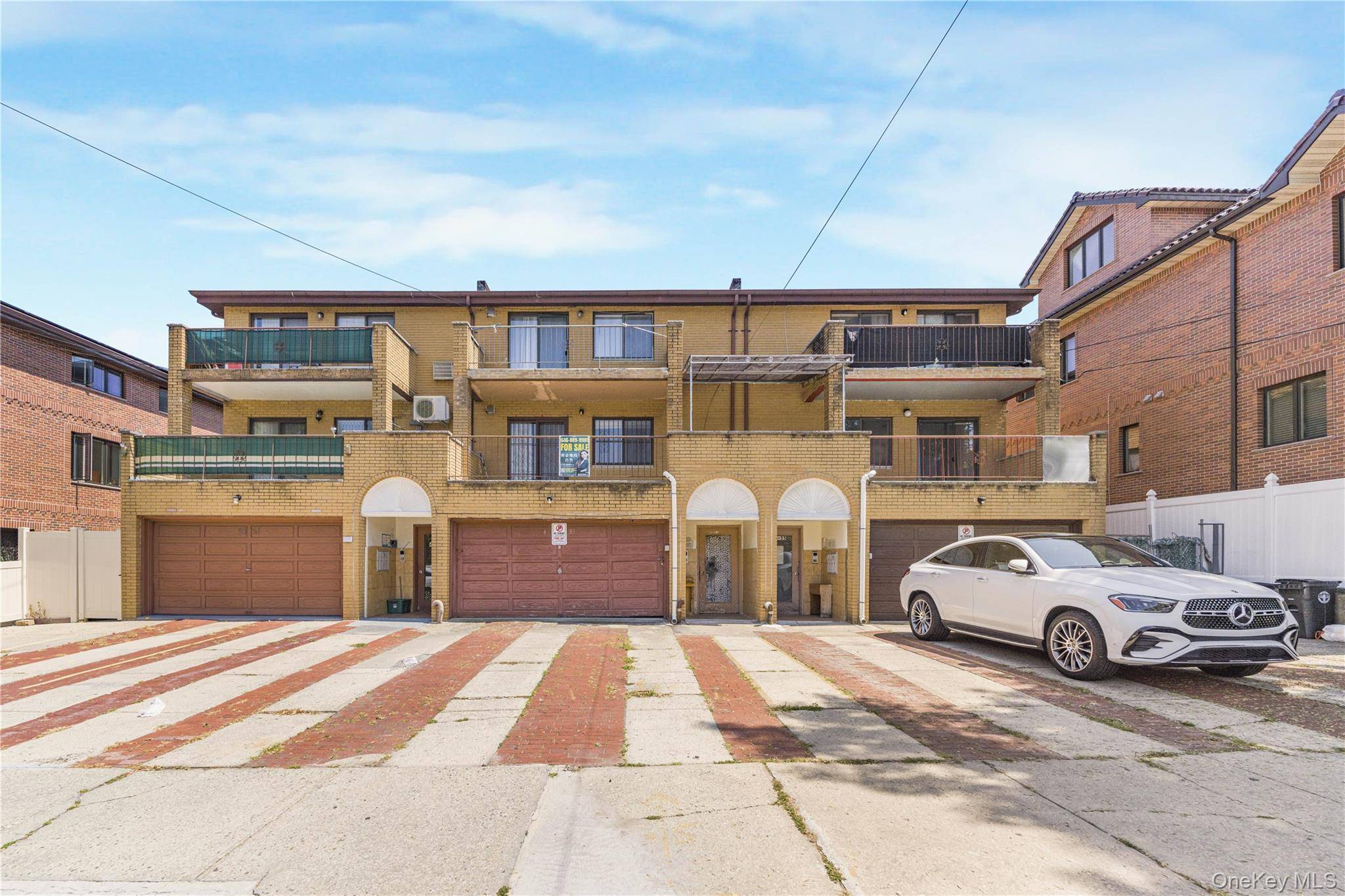 Welcome to this spacious and well maintained three family home located in the heart of Flushing.
