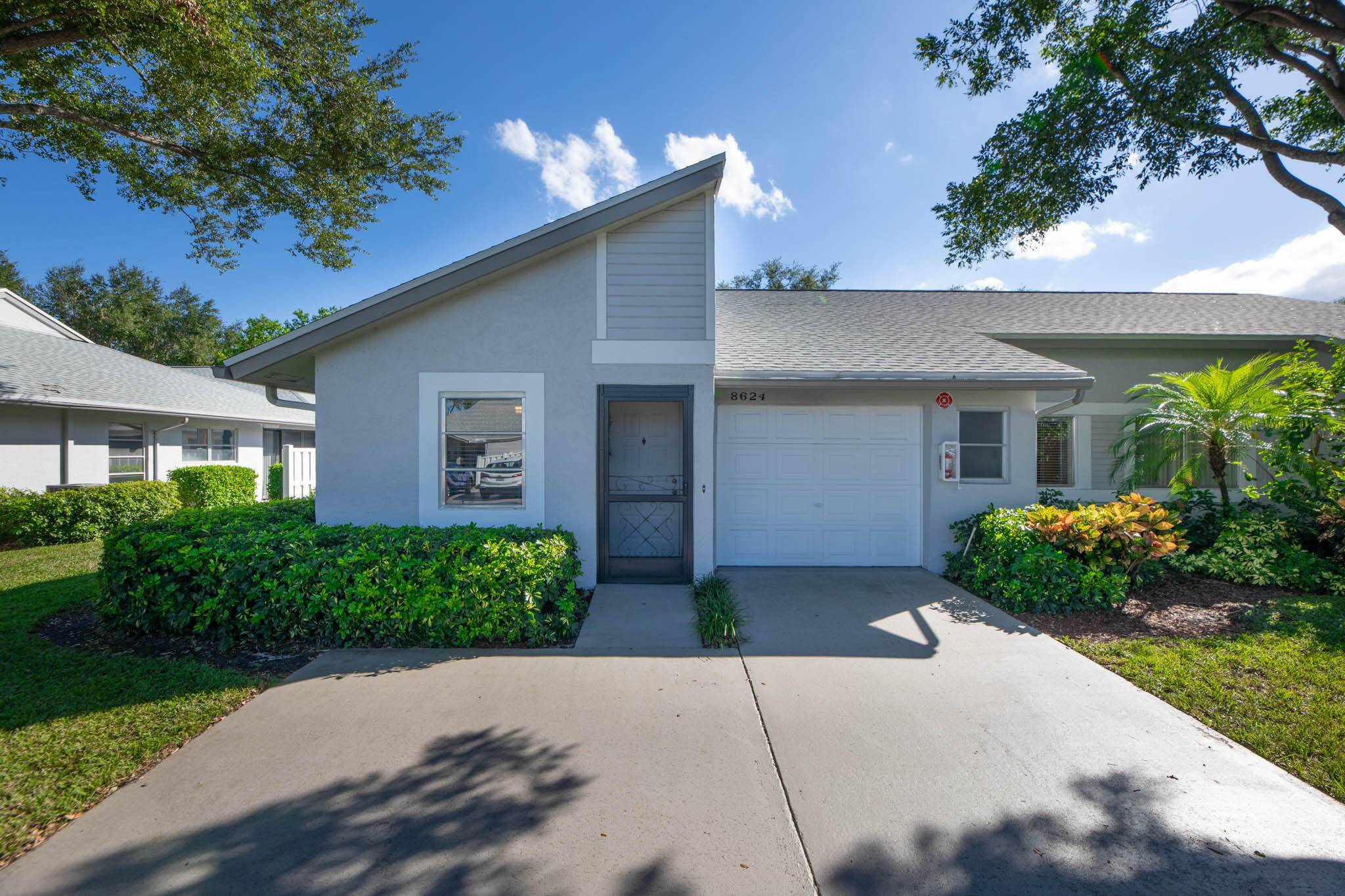 Beautifully maintained 2 2 Corner Villa in desireable Whisper Walk W GARAGE.