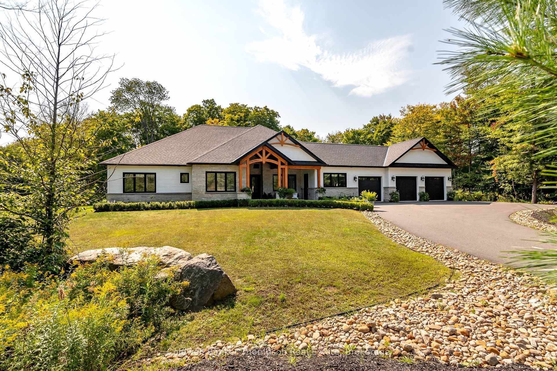 Welcome to this sprawling executive bungalow in the highly desirable Woodland Heights community.