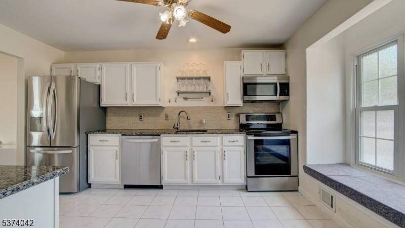 Welcome to this beautifully updated, pond view 2 bedroom, 2 bath townhouse tucked away in a private cul de sac in the most desirable section of Huntington Park.