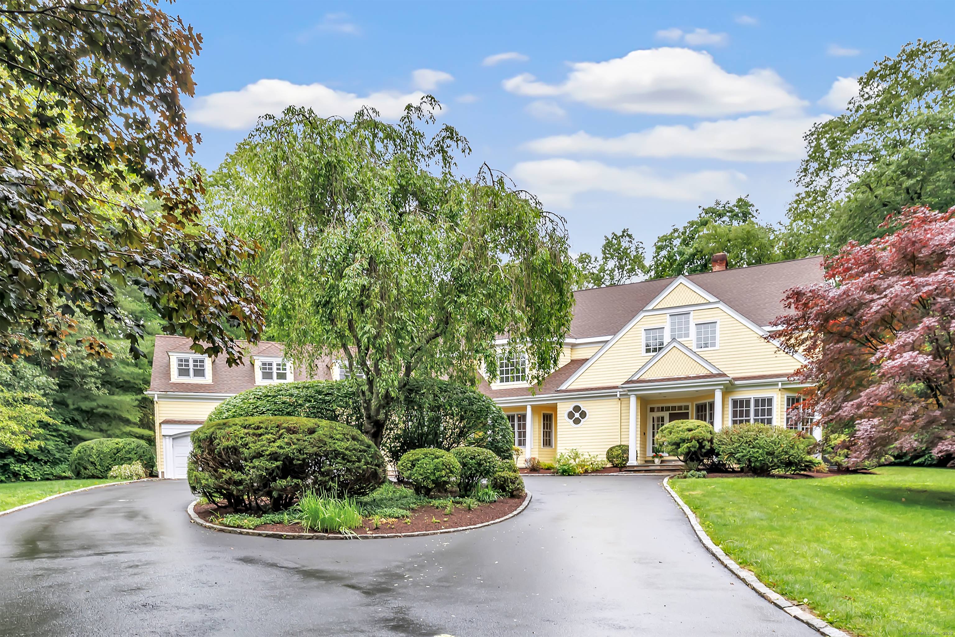 This stunning Colonial sits proudly on a beautifully landscaped 2 acre lot on the corner of Coley Drive, just over the Westport line in Lower Weston.