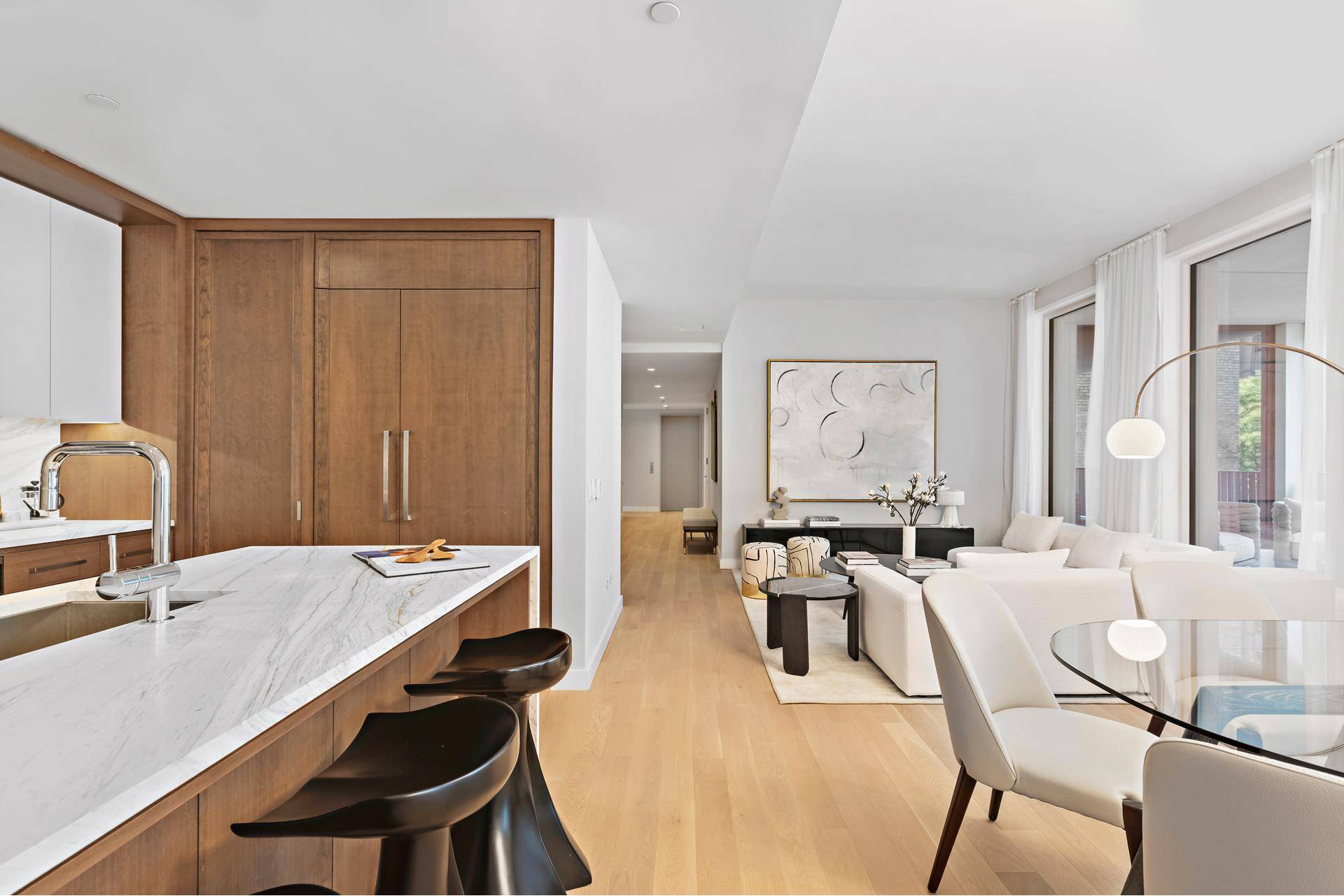 Boasting 2, 048 SF of exceptional space interior space with 244 SF of private outdoor space, Residence 5B offers gracious living across four bedrooms and three bedrooms.