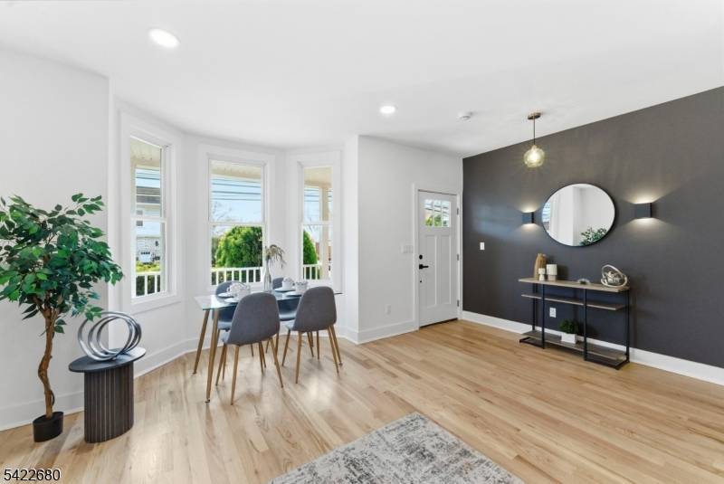 Exceptional gut renovated 2 family home in prime Clifton location completely taken down to the studs and rebuilt with high end modern finishes throughout.