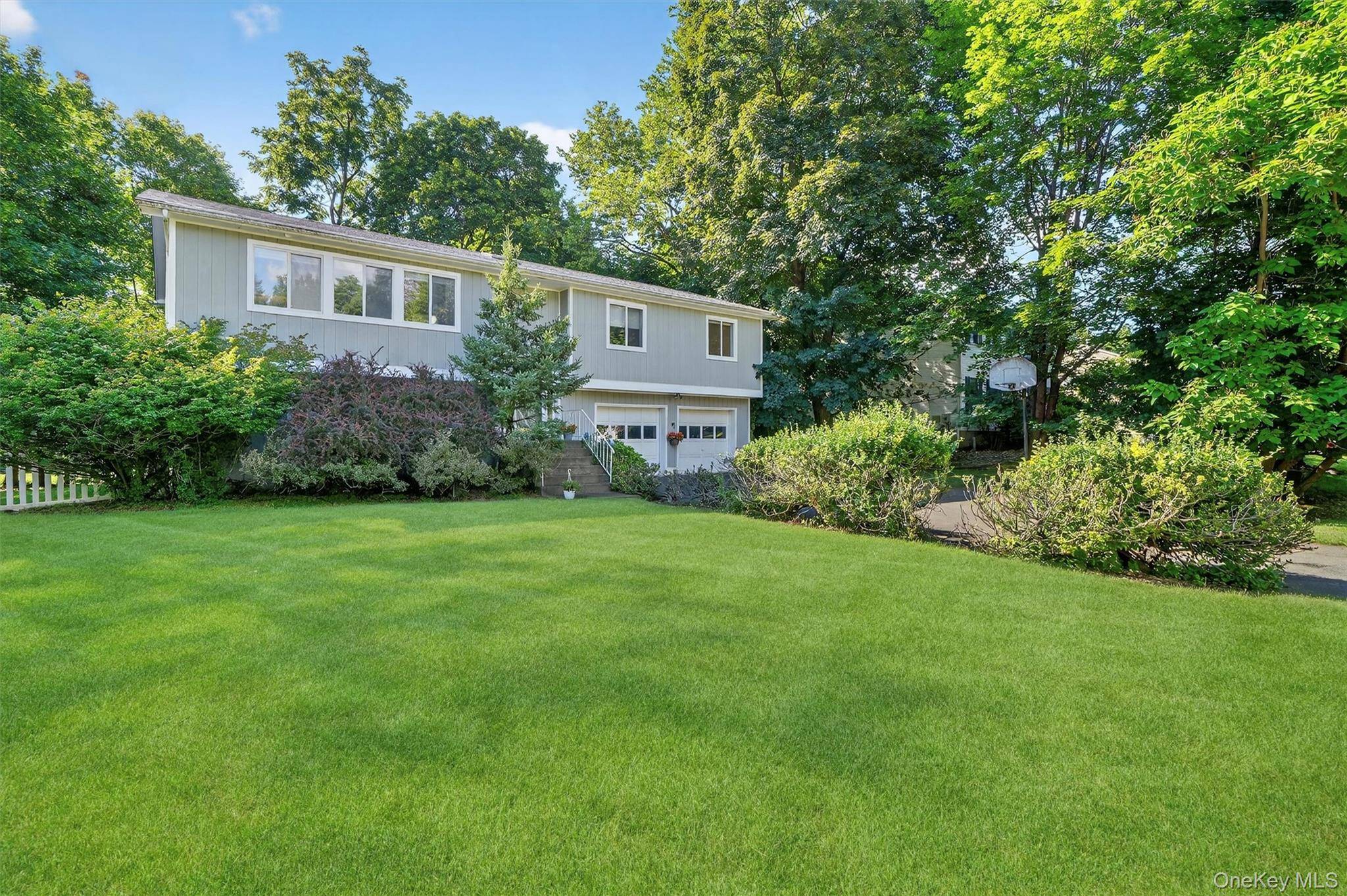 Set on a quiet cul de sac, this young, sun filled 4 bedroom, 3 bath contemporary raised ranch offers nearly 2, 400 square feet of spacious, modern living.