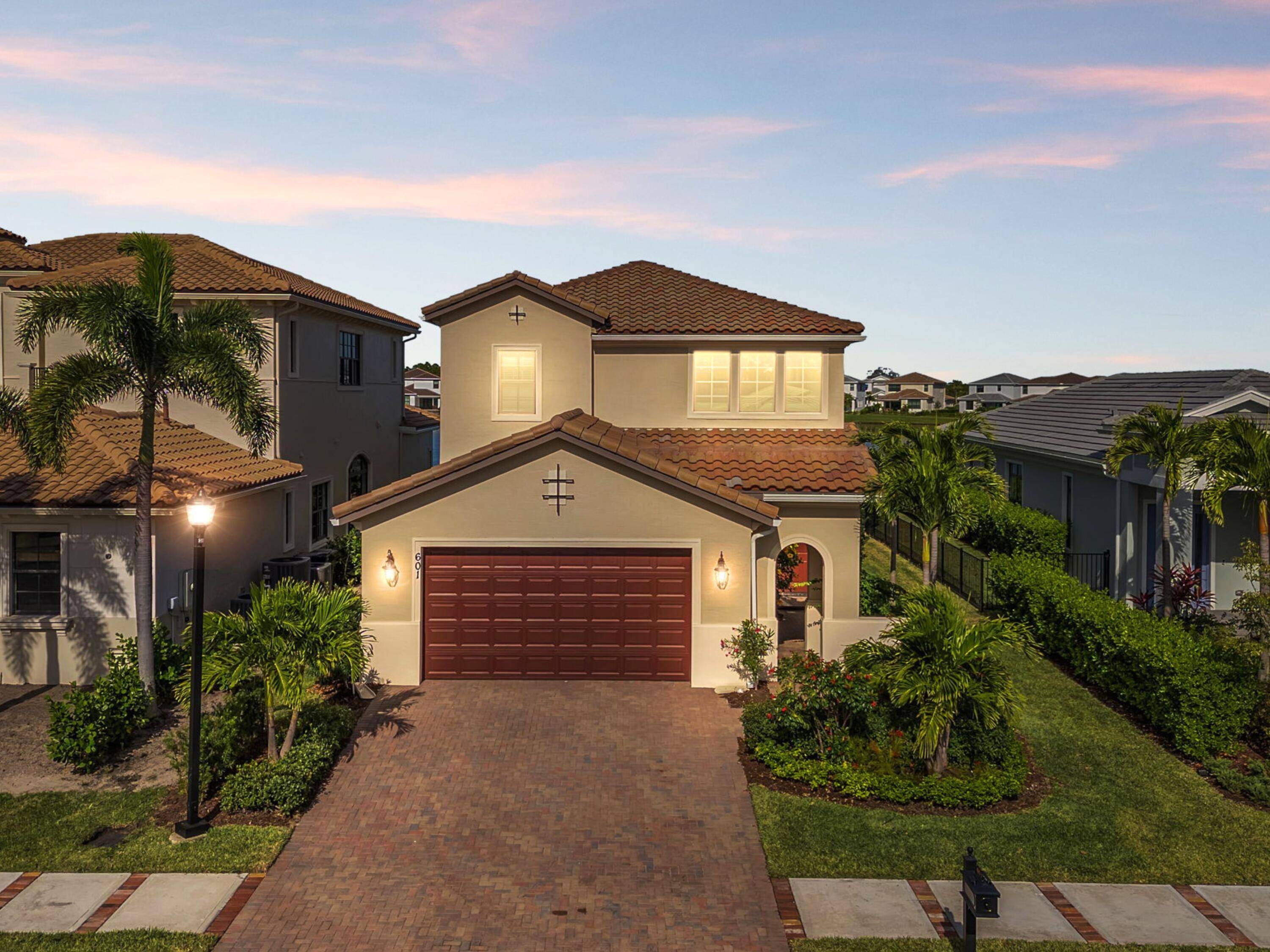 Luxury Lakefront Living, nestled in Tesoro Club, this 4 bedroom, 3.