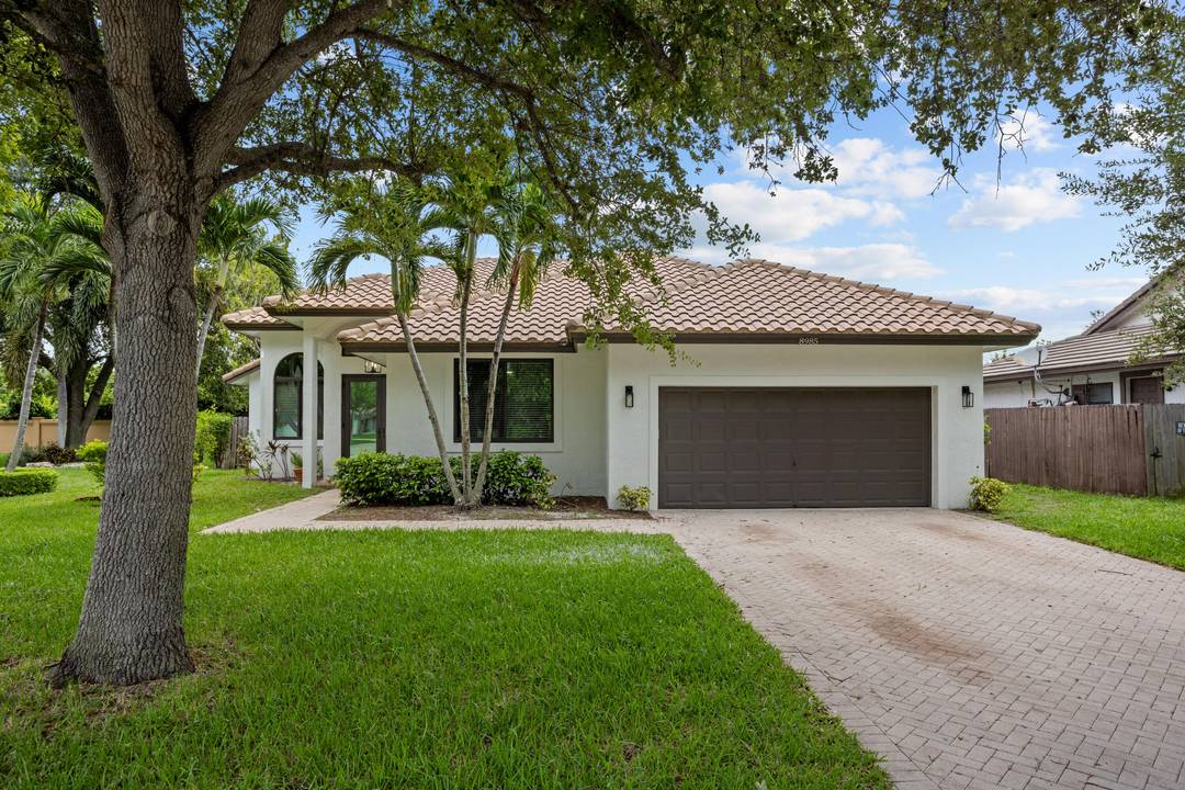 Experience the ultimate in modern living at 8985 NW 45th Court in Coral Springs !