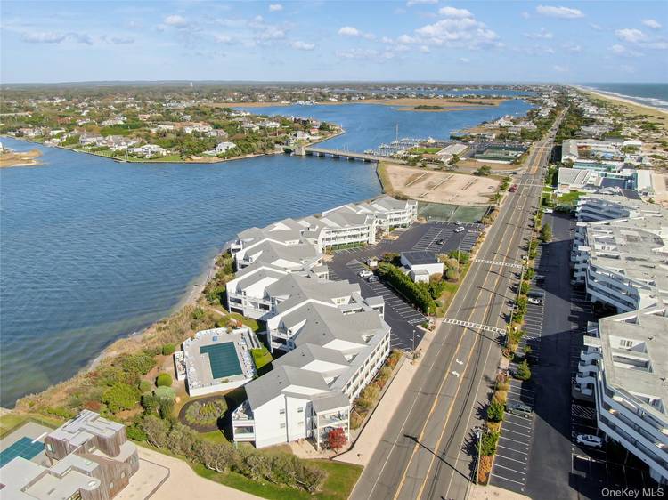 Spend your August soaking up the sun and sunsets in this stunning, fully renovated bayfront condo located in the Yardarm community of Westhampton Beach Village.