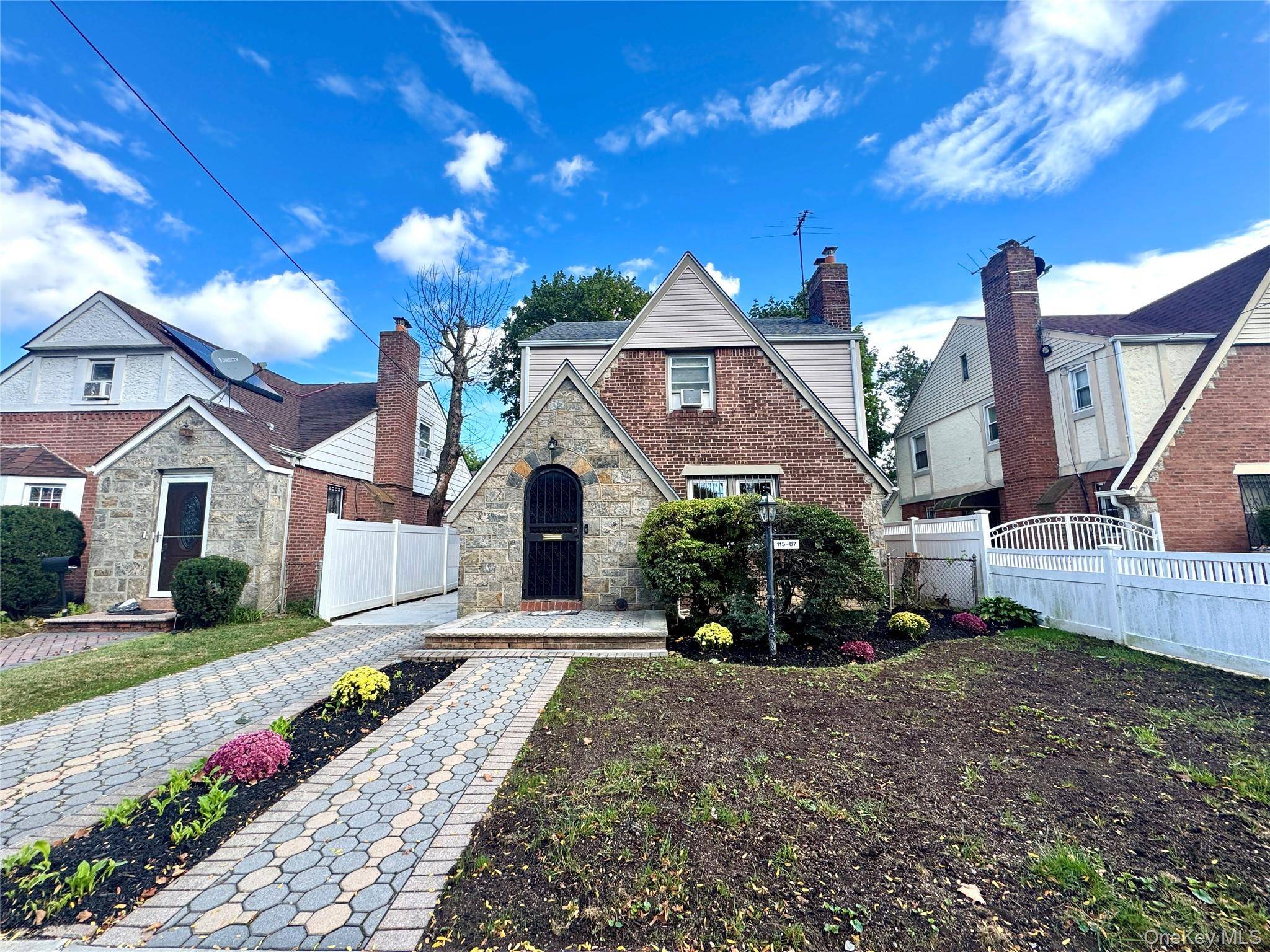 Nestled in the heart of Cambria Heights, this delightful one family Tudor blends classic charm with modern convenience.