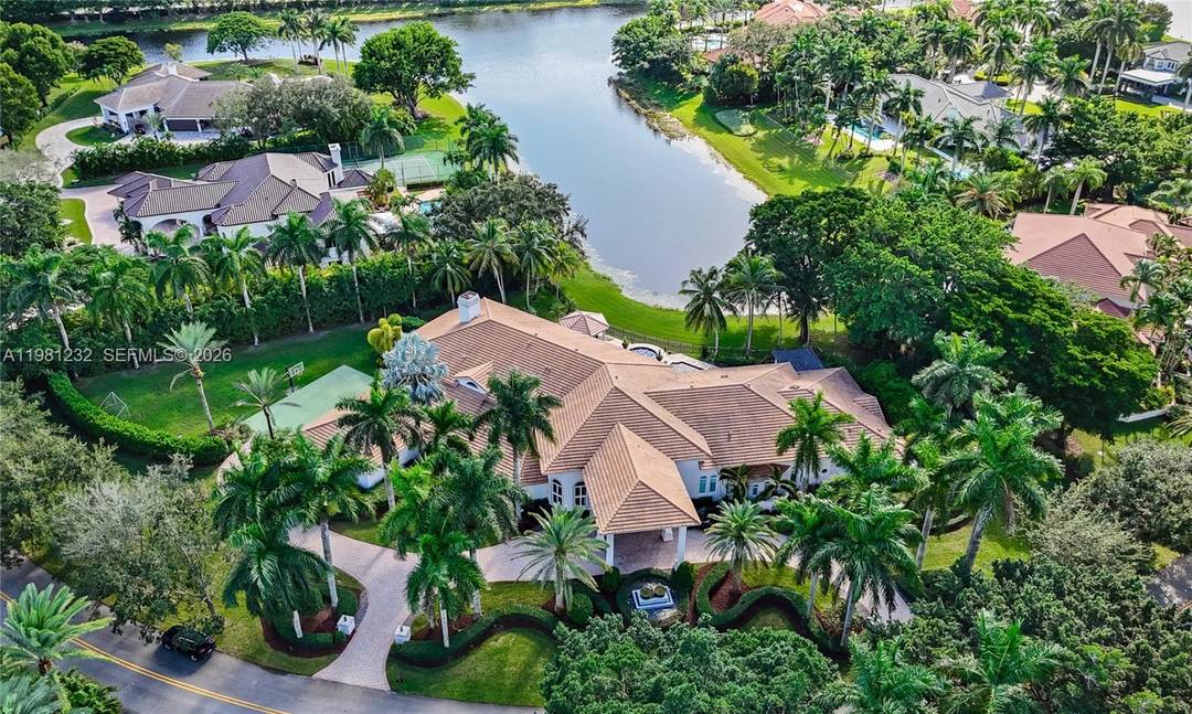 Fully reimagined lakefront estate in the prestigious community of Windmill Ranch Estates in Weston.