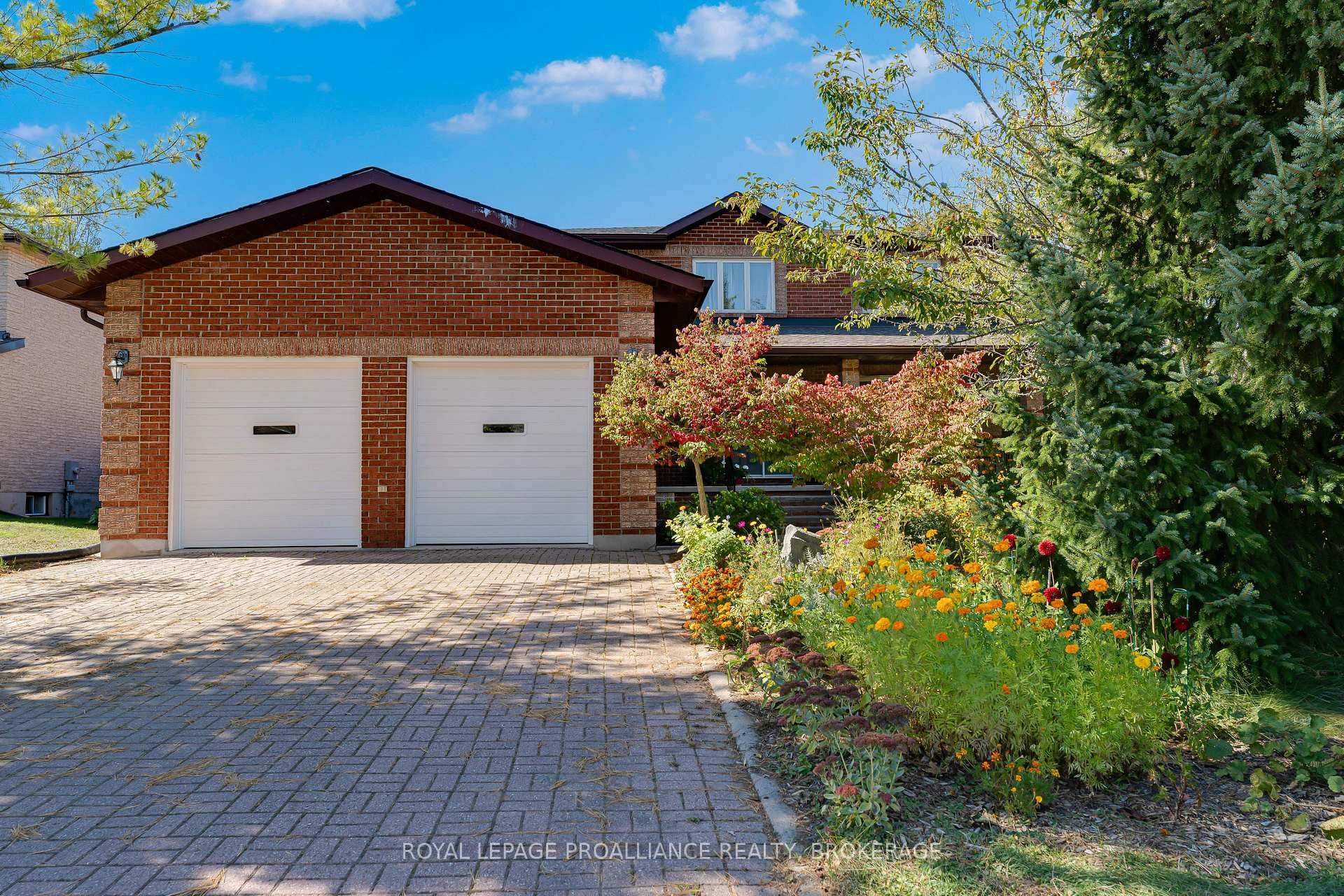 Stunning 4 bedroom all brick, 2 storey home, set on a spacious and private lot in one of Kingston's most desirable west end neighbourhoods Auden Park.