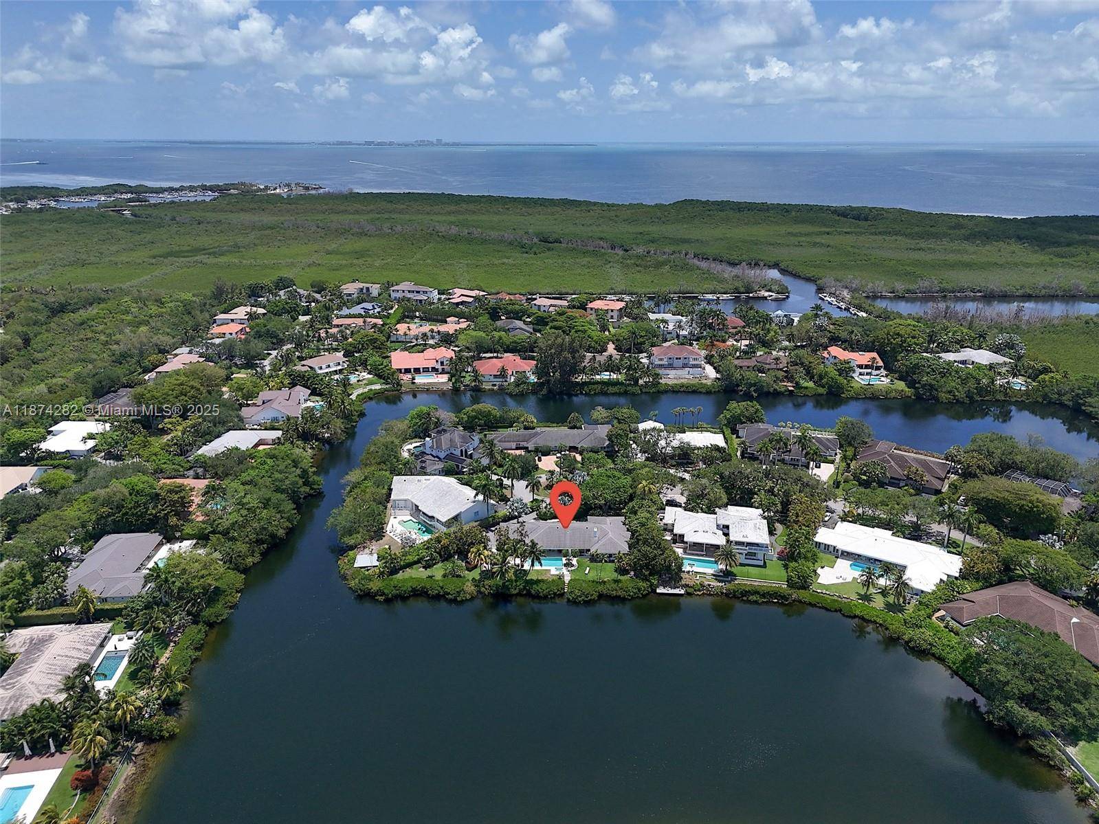 Discover this impeccable lakefront estate located in the prestigious Coral Gables area, tucked away in a quiet cul de sac on an oversized lot with the community s widest, most ...