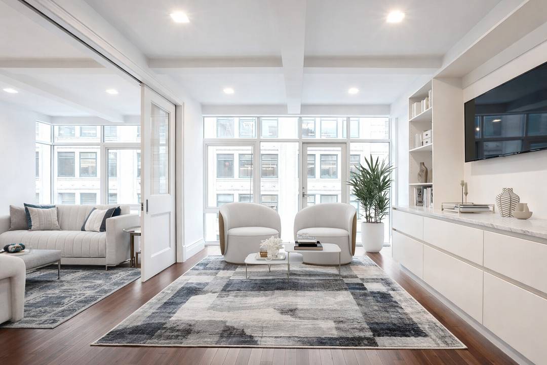 Residence 6 7A is a rare triplex loft style home occupying the top floors and private rooftop of a boutique condominium in the heart of Hudson Square.