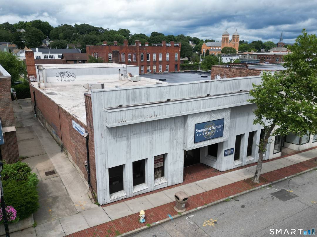 Downtown office or potential retail building for sale in Windham CT's Willimantic CDP.