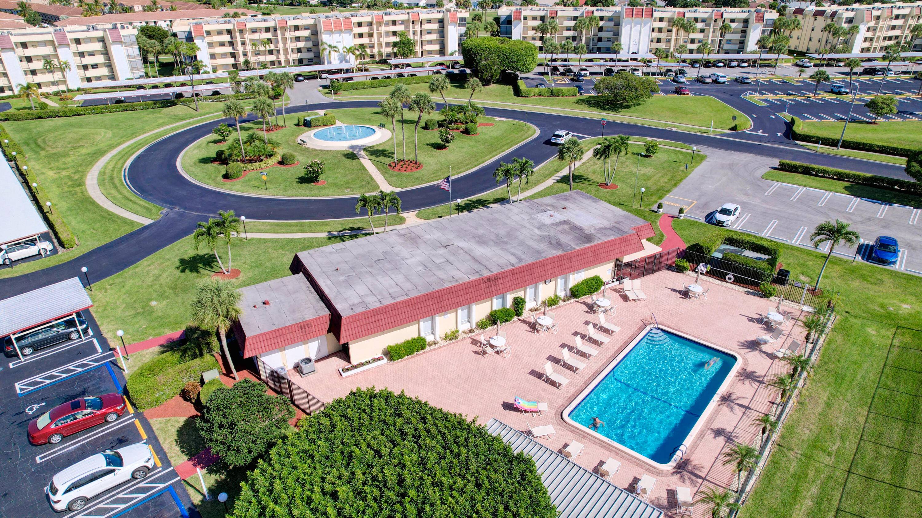 Look No Further Cozy First Floor unit in West Boca w assigned carport parking just outside of the unit.