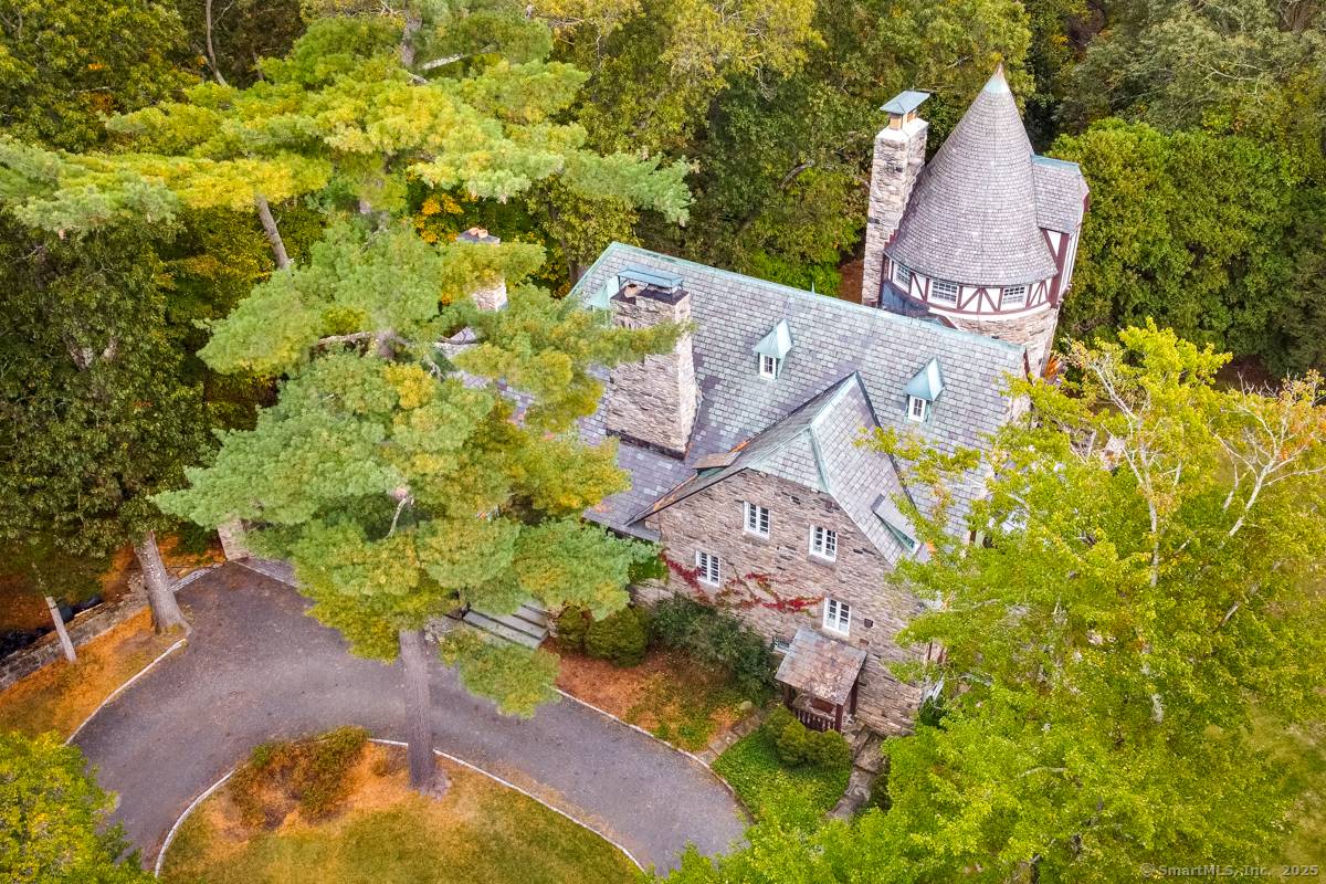 Chateau Rochamore a French Normandy stone manor of timeless grace sits on over three park like acres in North Stamford.