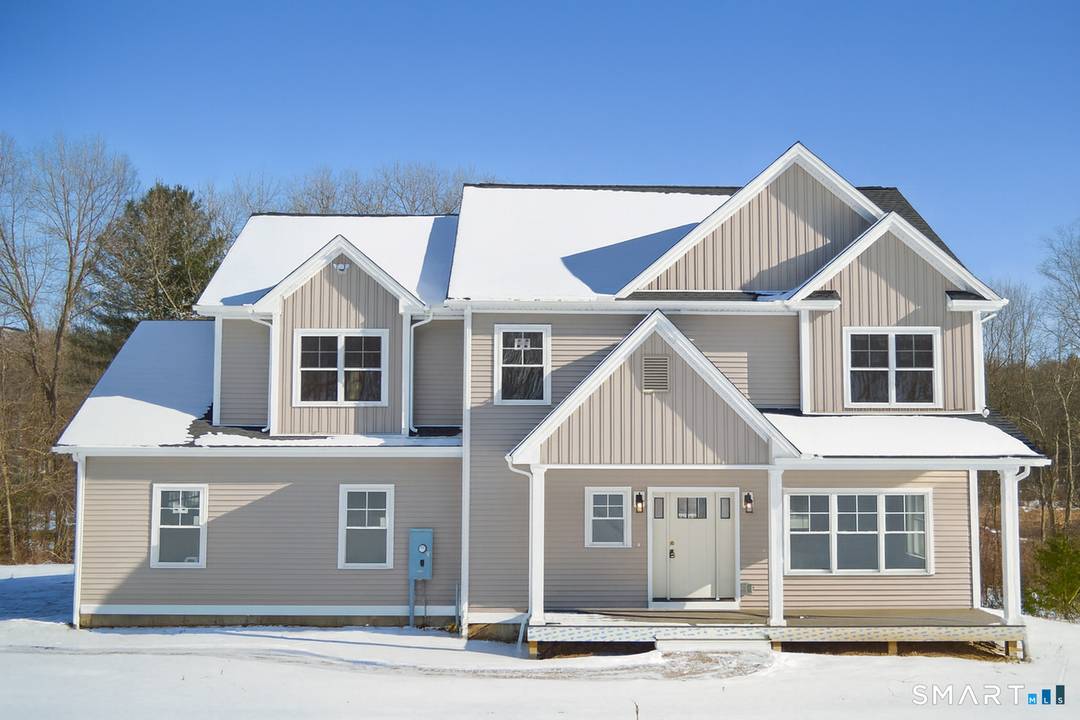 This new construction home blends modern comfort with timeless farmhouse style.