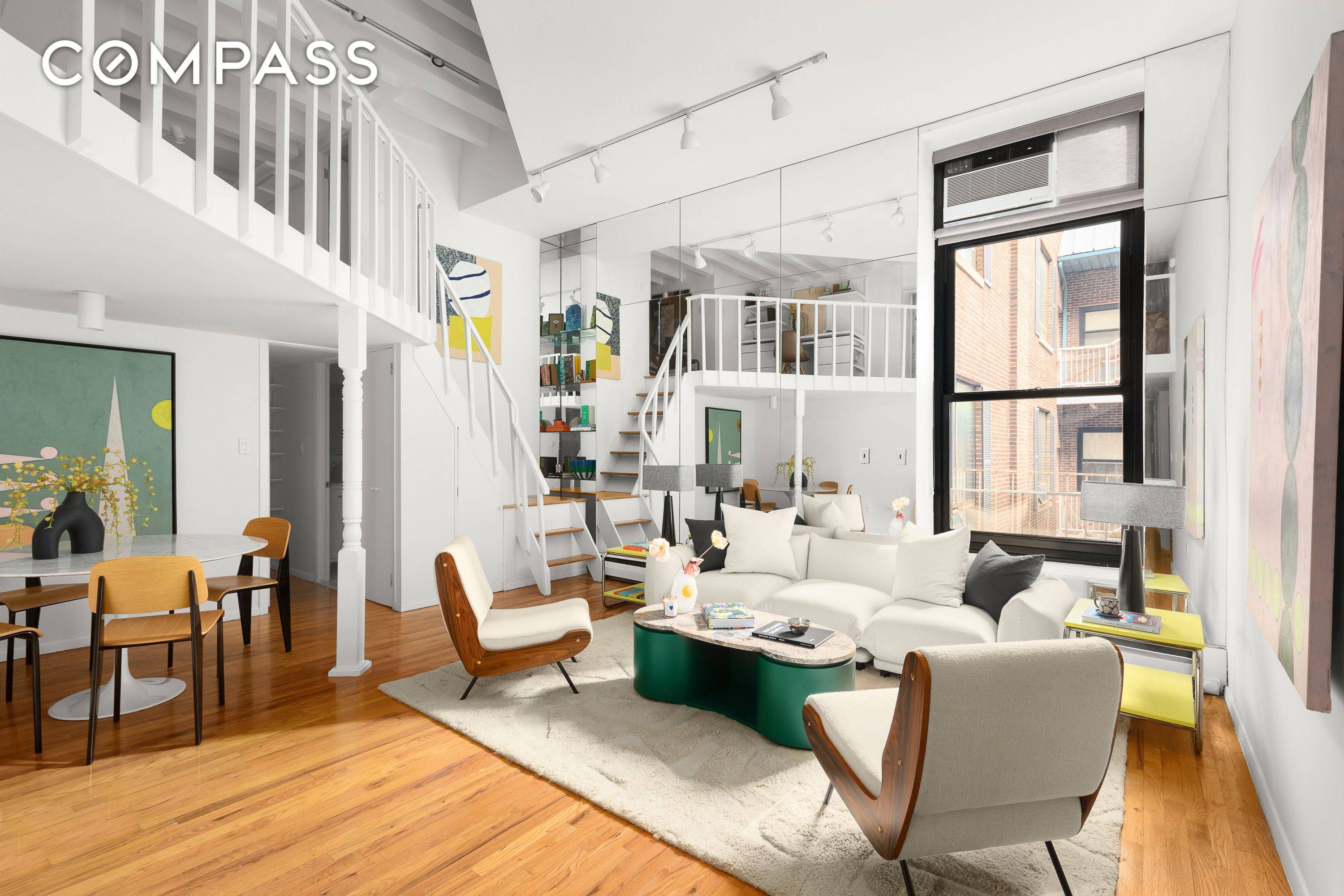 An expansive duplex loft offering one bedroom and one and a half bathrooms, with striking proportions, soaring ceilings, and a distinctive layout in a full service Greenwich Village building on ...
