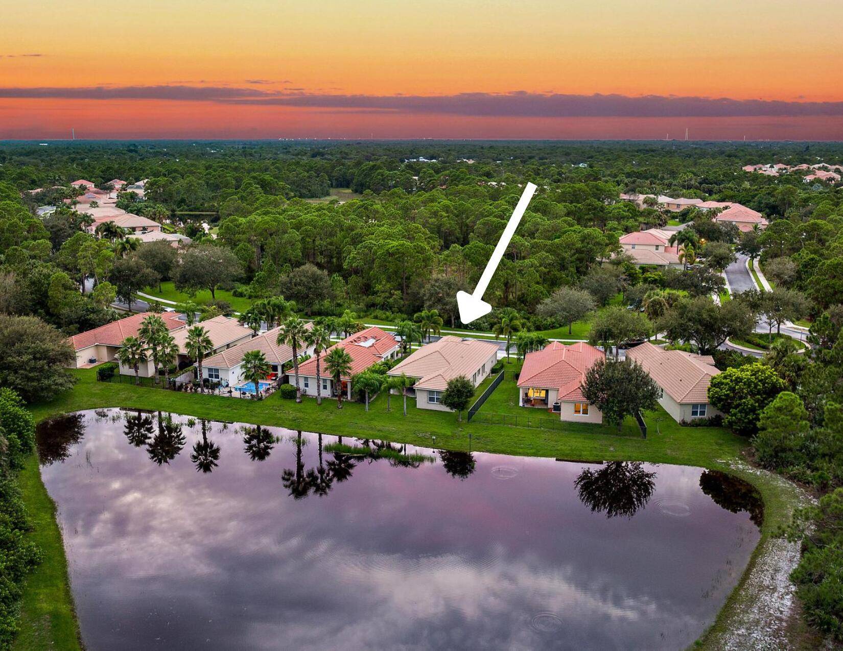 Nestled in the prestigious gated community of The Oaks of Hobe Sound, this enchanting single story home offers the perfect blend of comfort and sophistication.