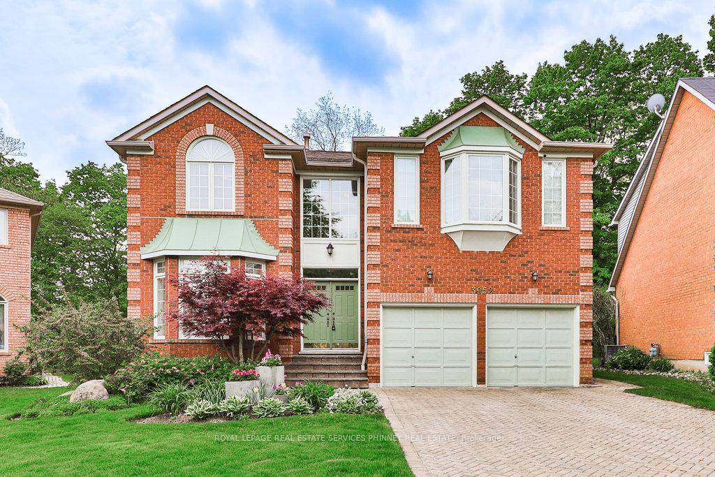 Nestled at the edge of a serene ravine, this meticulously maintained home offers the perfect blend of tranquility and potential.