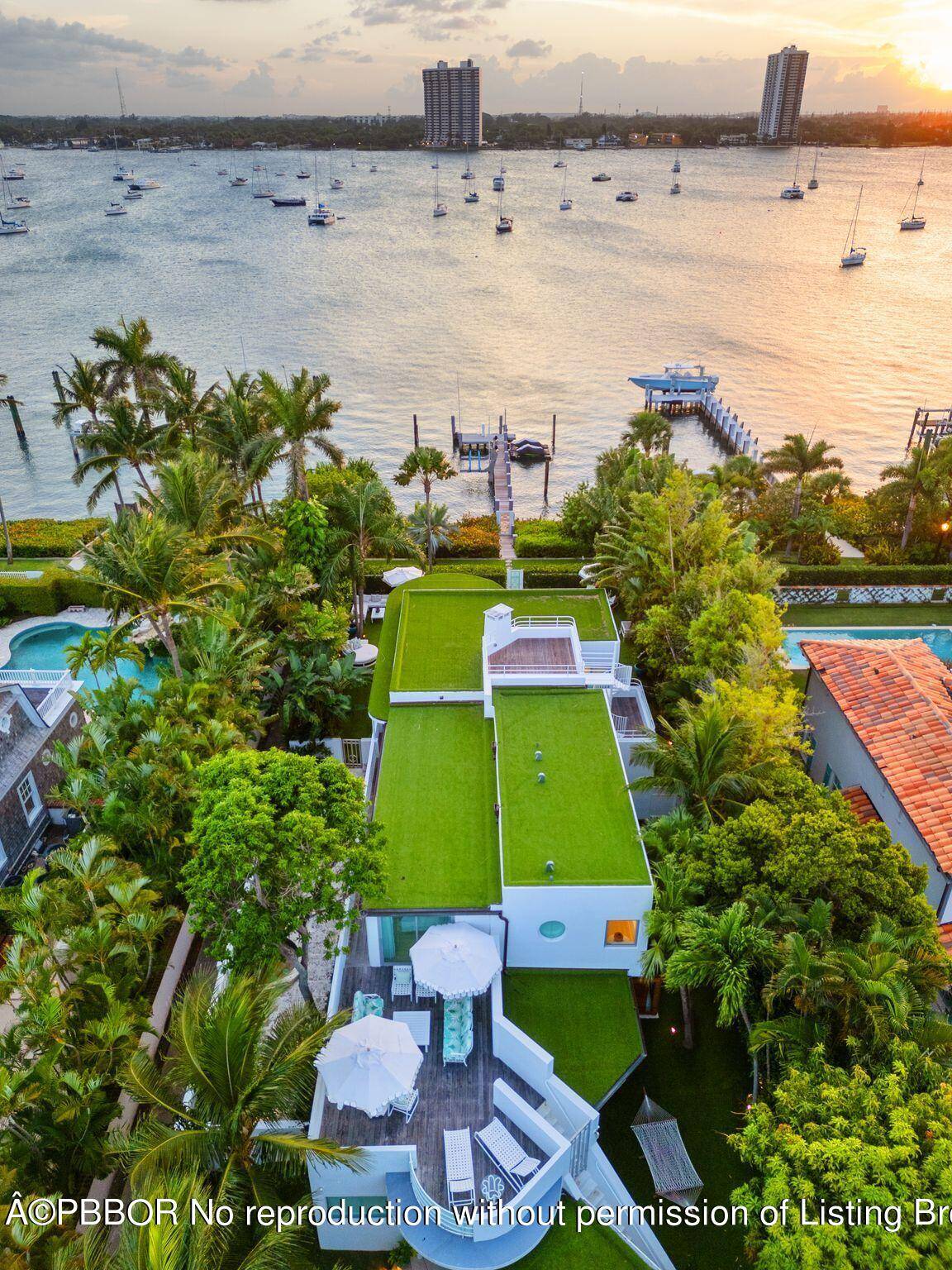 A beautifully renovated, masterful landmark of Modernist architecture, the Boat House combines the very best elements of life in Palm Beach the perfect spot on the lakefront with dock and ...