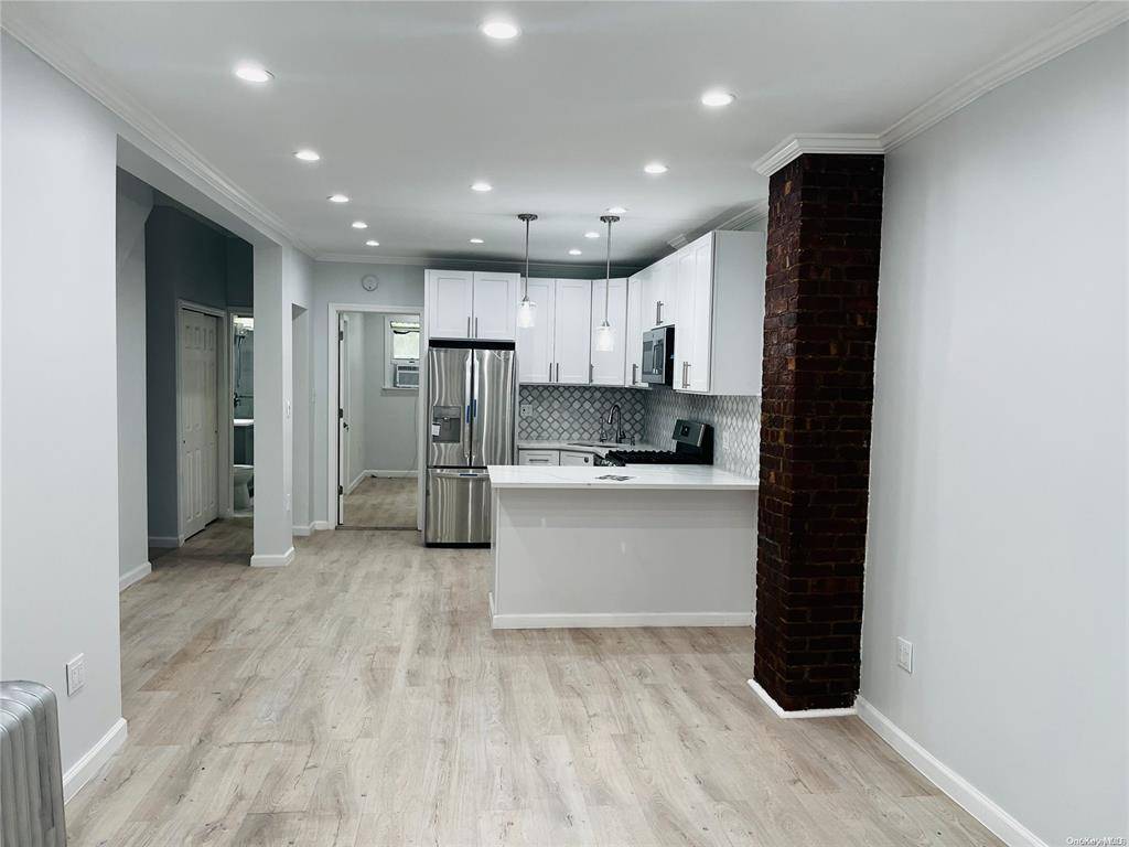 Welcome to this beautifully renovated 2 family home nestled in the heart of Astoria, Queens.