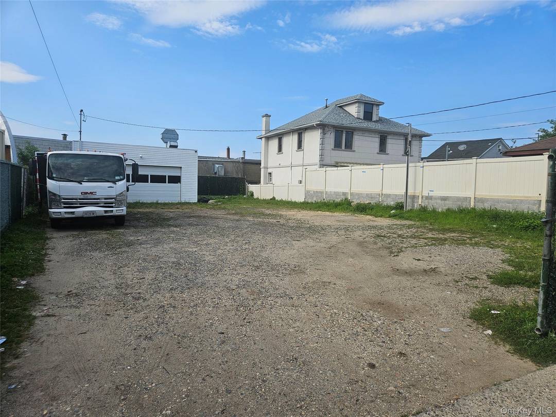 commercial vacant lot plus a 2 car garage that can be used for multi purpose 0ffice shop and the lot is good for Parking commercial vehicles or whatever use deemed ...