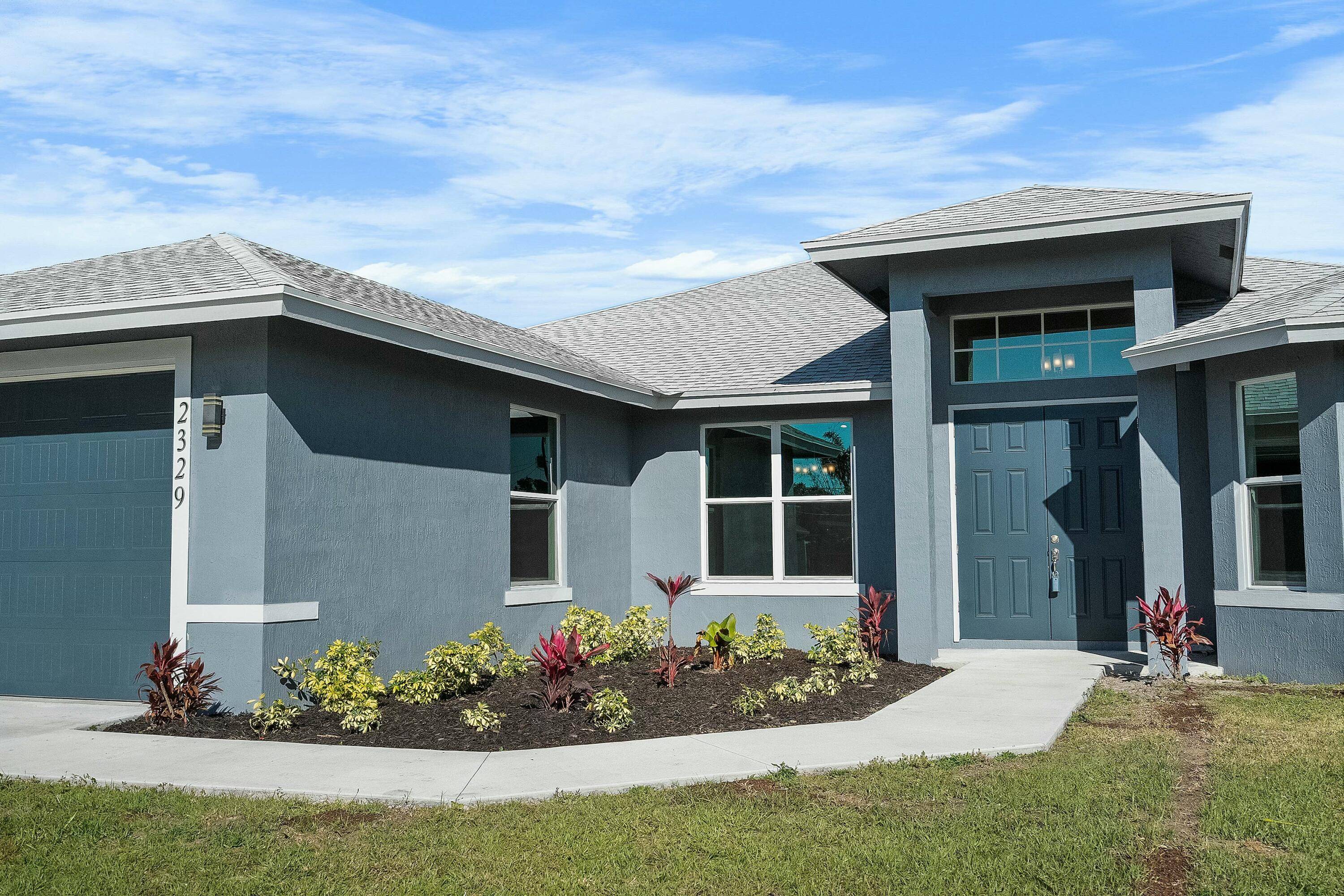 Experience luxury living in this 2023 CBS built masterpiece in Port St.