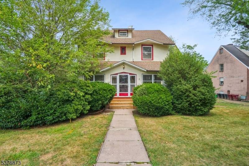 Charming Colonial with beautiful Parquet Floors w ribbon trim in Living Room, Dining Room and Family Room.