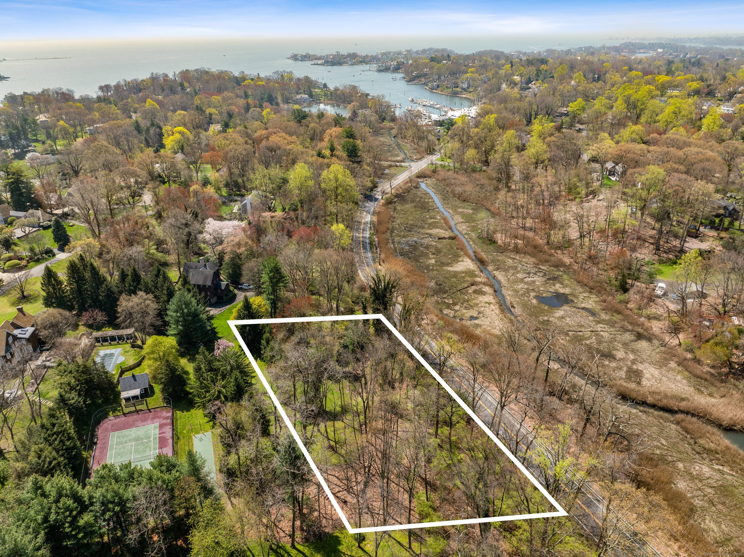 Unbelievable opportunity to build your ideal home on this stunning rare 1 acre parcel in coveted Wilson Point Association.