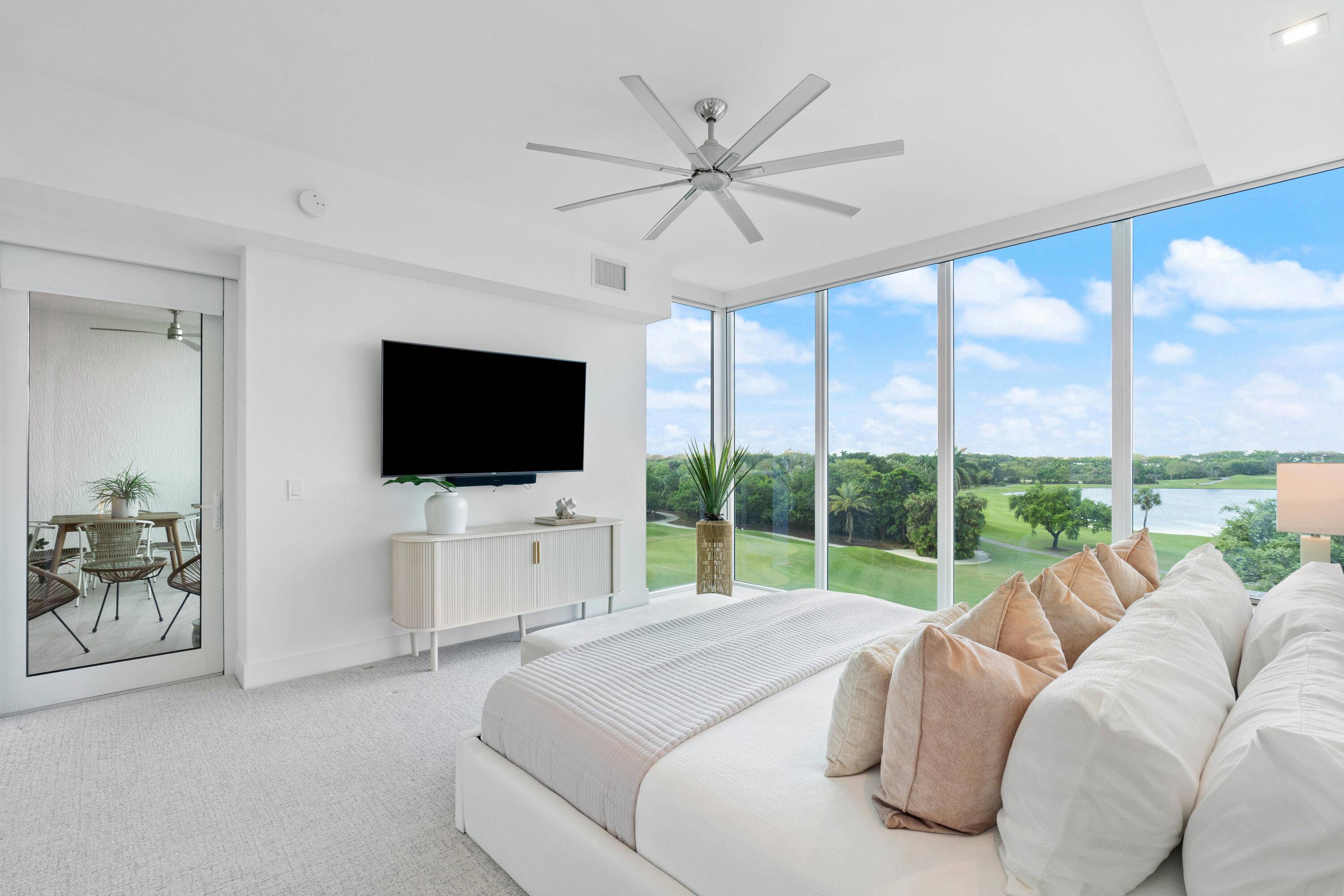 Forever golf and sparkling lake views from this beautiful 2 bedroom plus den, 2 1 2 bath condo in the luxurious Akoya complex.
