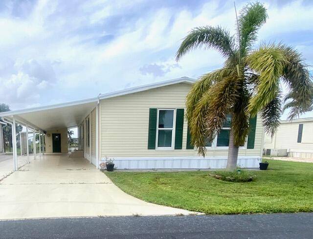 Take a look at this spacious mobile home on the water with a beautiful dock and plenty of extras !
