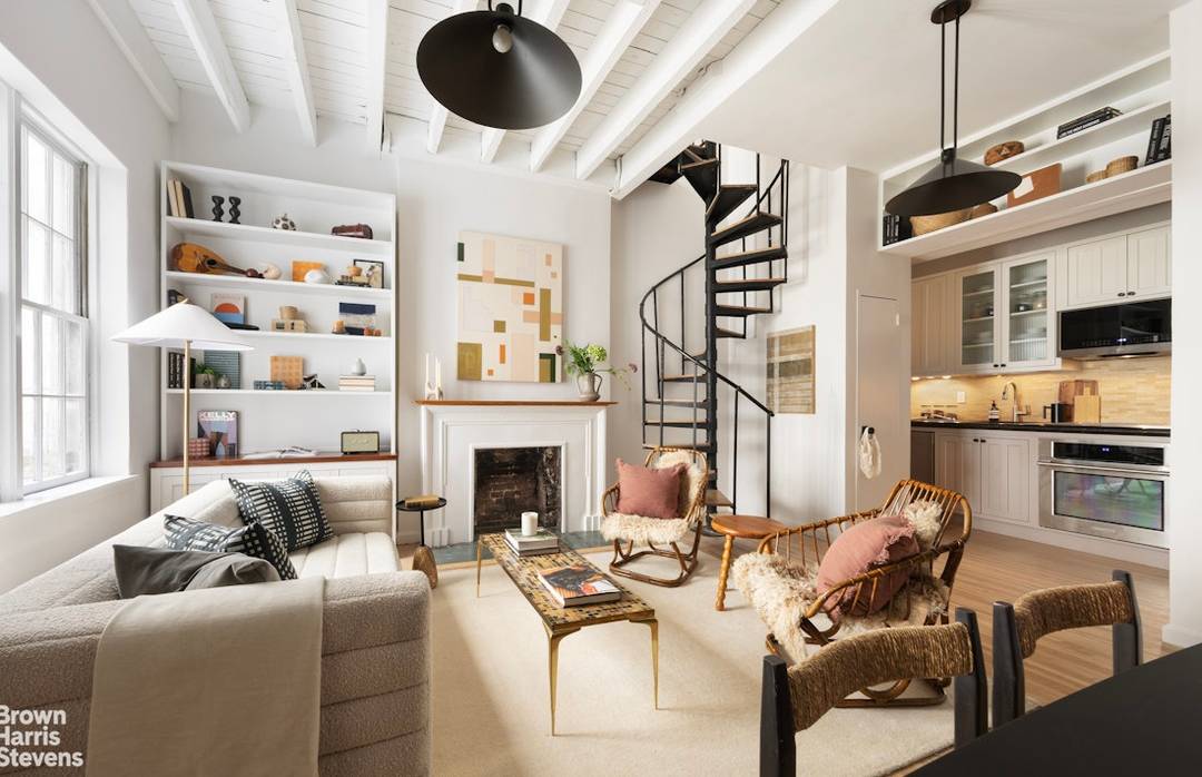 IMMACULATELY RENOVATED, sun drenched duplex with PRIVATE TERRACE, WOOD BURNING FIREPLACE and IN UNIT WASHER DRYER.