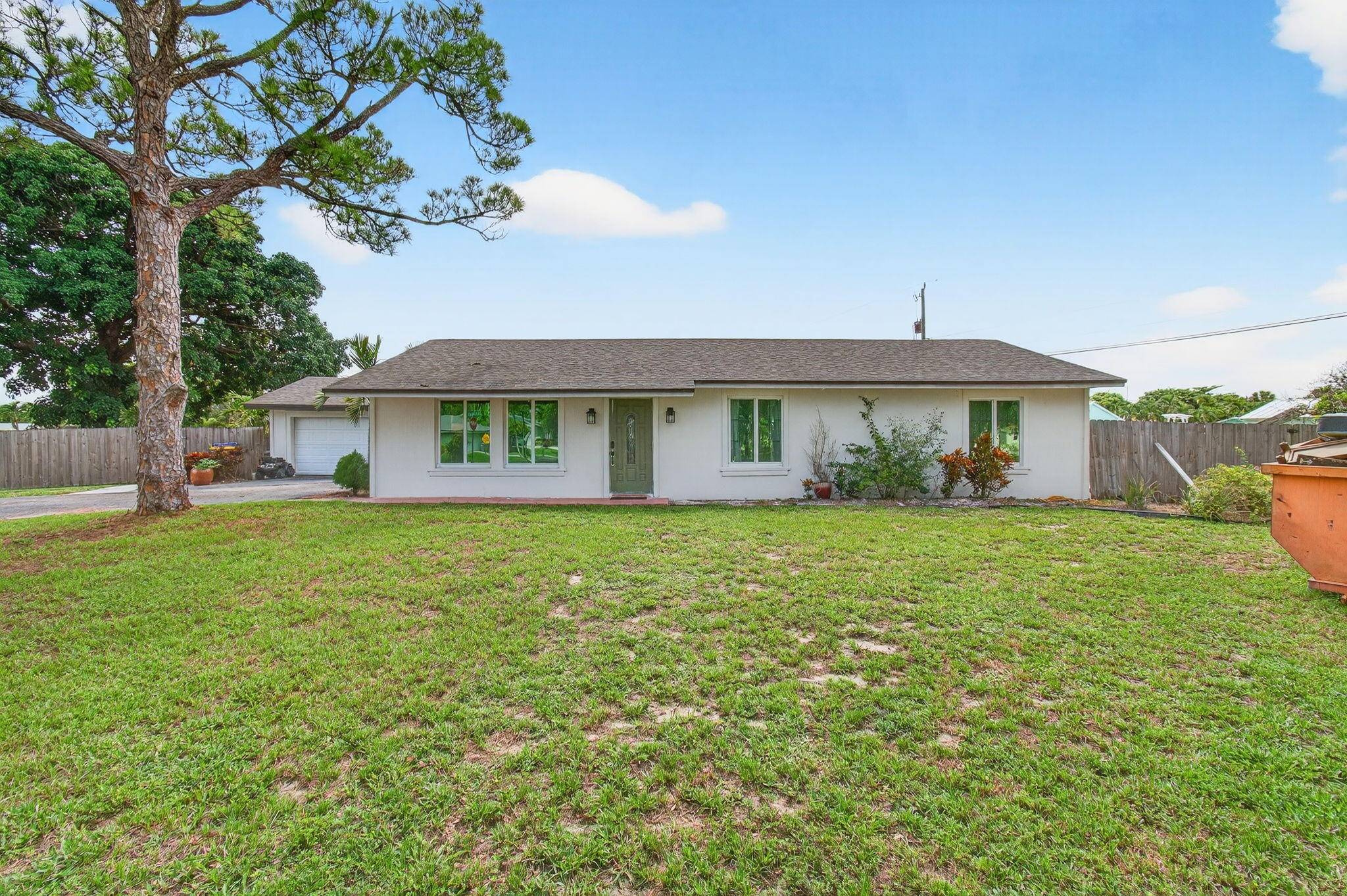 Situated on a rare corner double lot just under a half acre, this non HOA property offers incredible potential in a prime Delray Beach location.