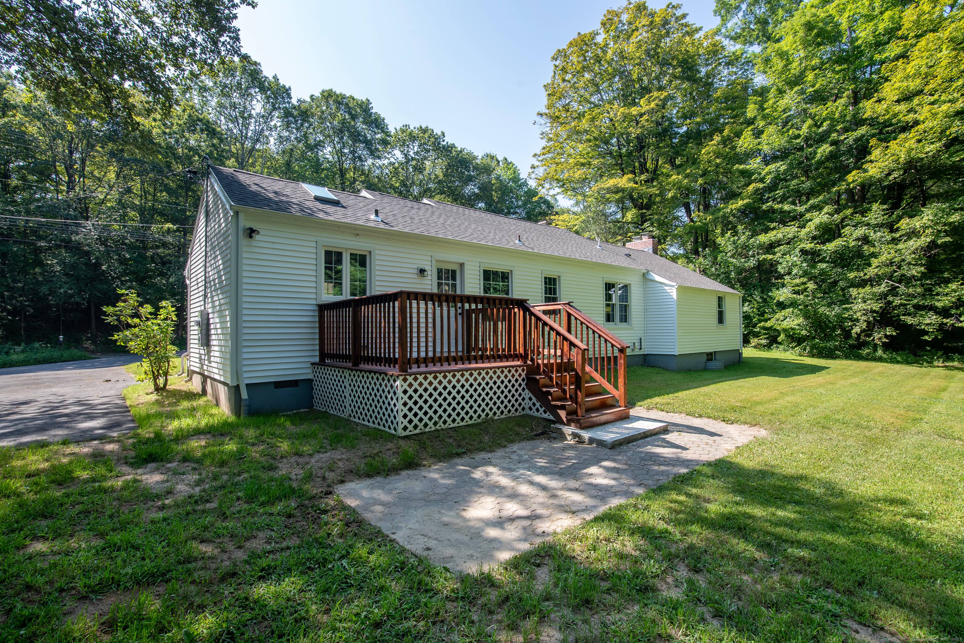 This spacious ranch style house has a new roof, new vinyl siding, some new windows and new deck plus covered front porch.