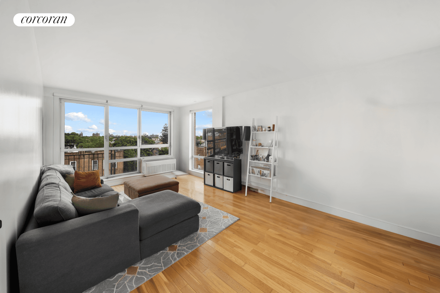 A deeded parking space with an electric charger and a private storage space are included.