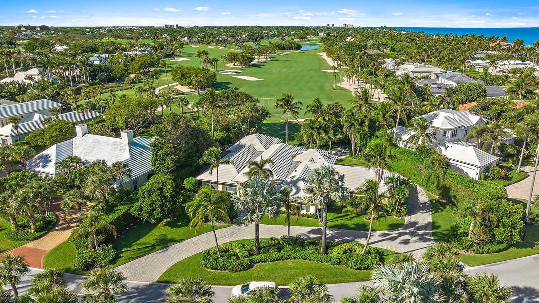 Ideally positioned on the 15th green, this meticulously maintained golf course residence captures the essence of life in Lost Tree Village one of Florida's most prestigious oceanfront communities.