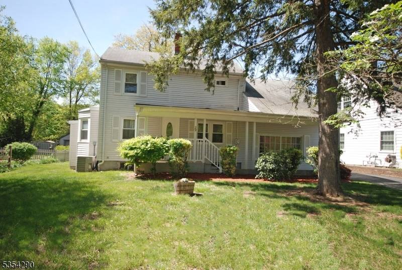 Step right into this well maintained custom home offering incredible flexibility with dual staircases and separate living spaces.