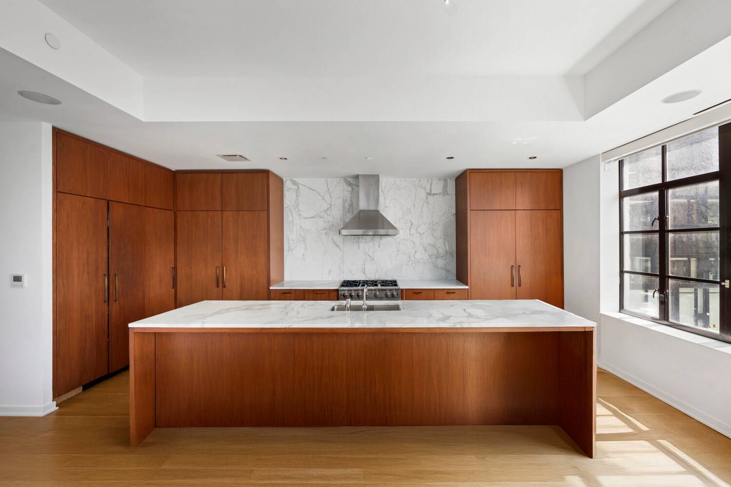 Enjoy luxurious, modern Chelsea loft living with Empire State Building and High Line views in this dazzling corner condo with private outdoor space.