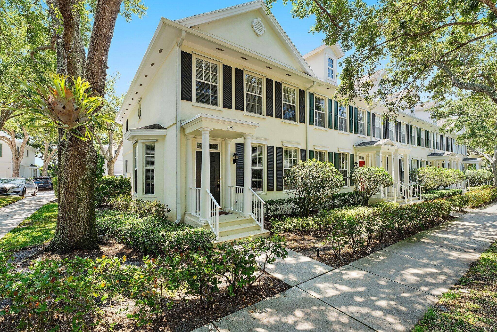 Experience the best of Abacoa living in this beautifully light filled corner townhome, perfectly situated in the desirable Charleston Court community.