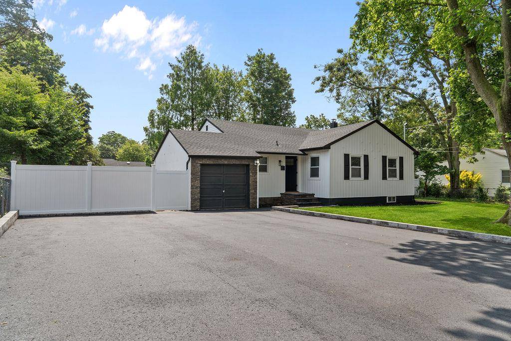Welcome to 147 Juniper Avenue in Smithtown, a beautifully updated ranch style home that combines modern finishes with timeless charm.