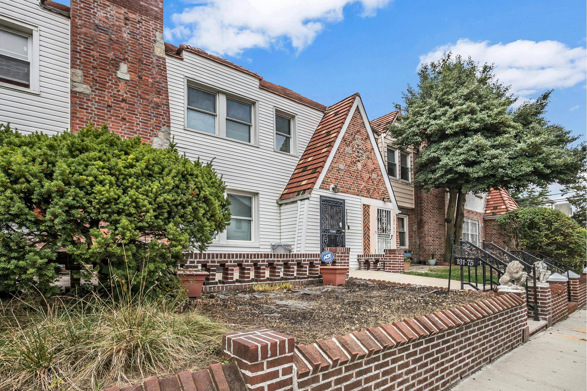 Lovely Attached Tudor Home Located in Laurelton.