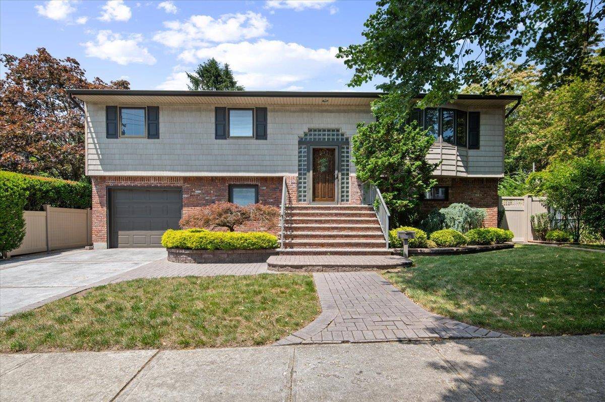 Step into this spacious amp ; sun filled 4 Br, 2Fbth Hi Ranch that blends modern luxury with comfortable living.