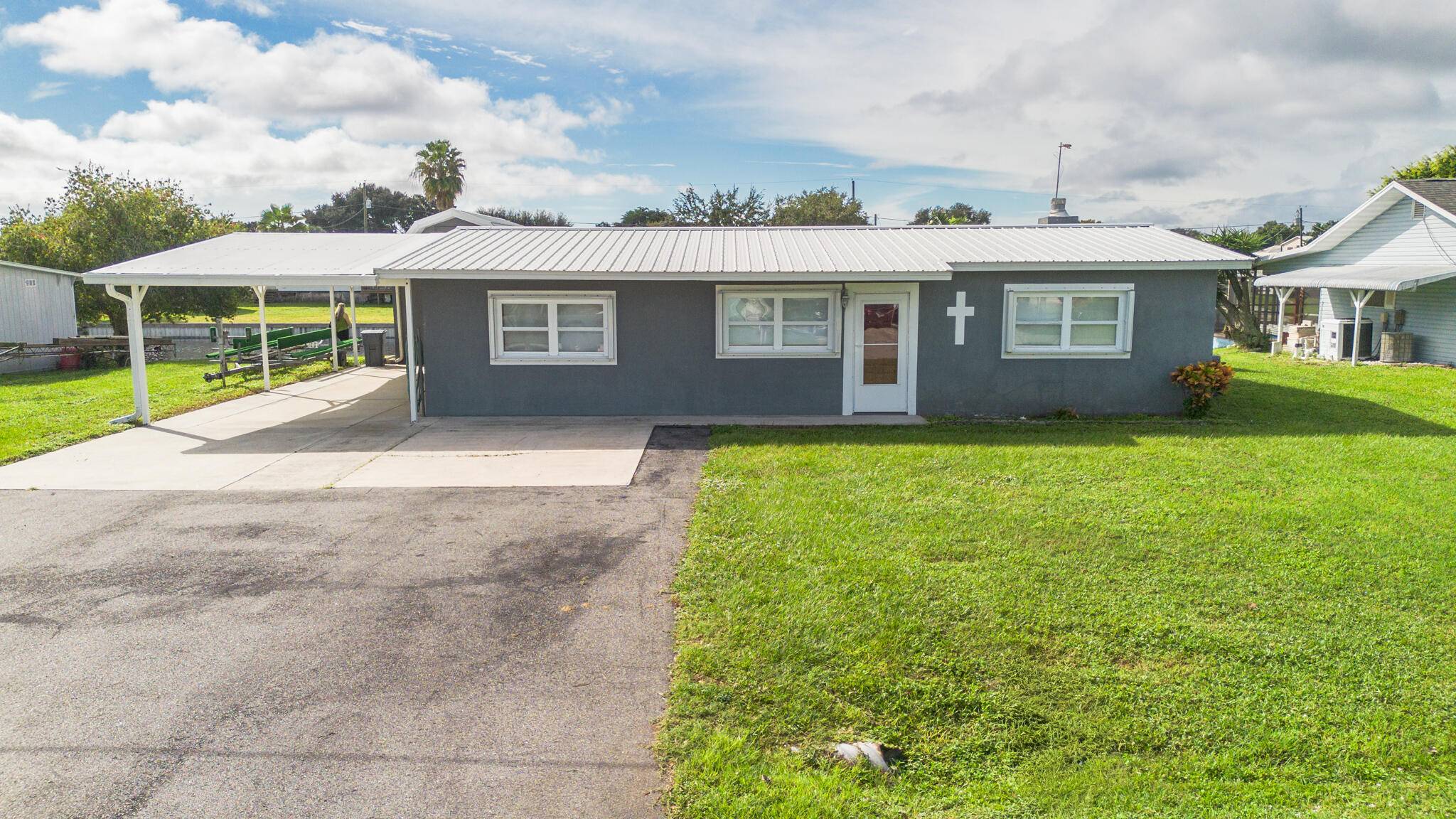 Taylor Creek Isles Lake Access Well maintained 3 bedroom, 2 bath CBS home offering 1, 672 sq.